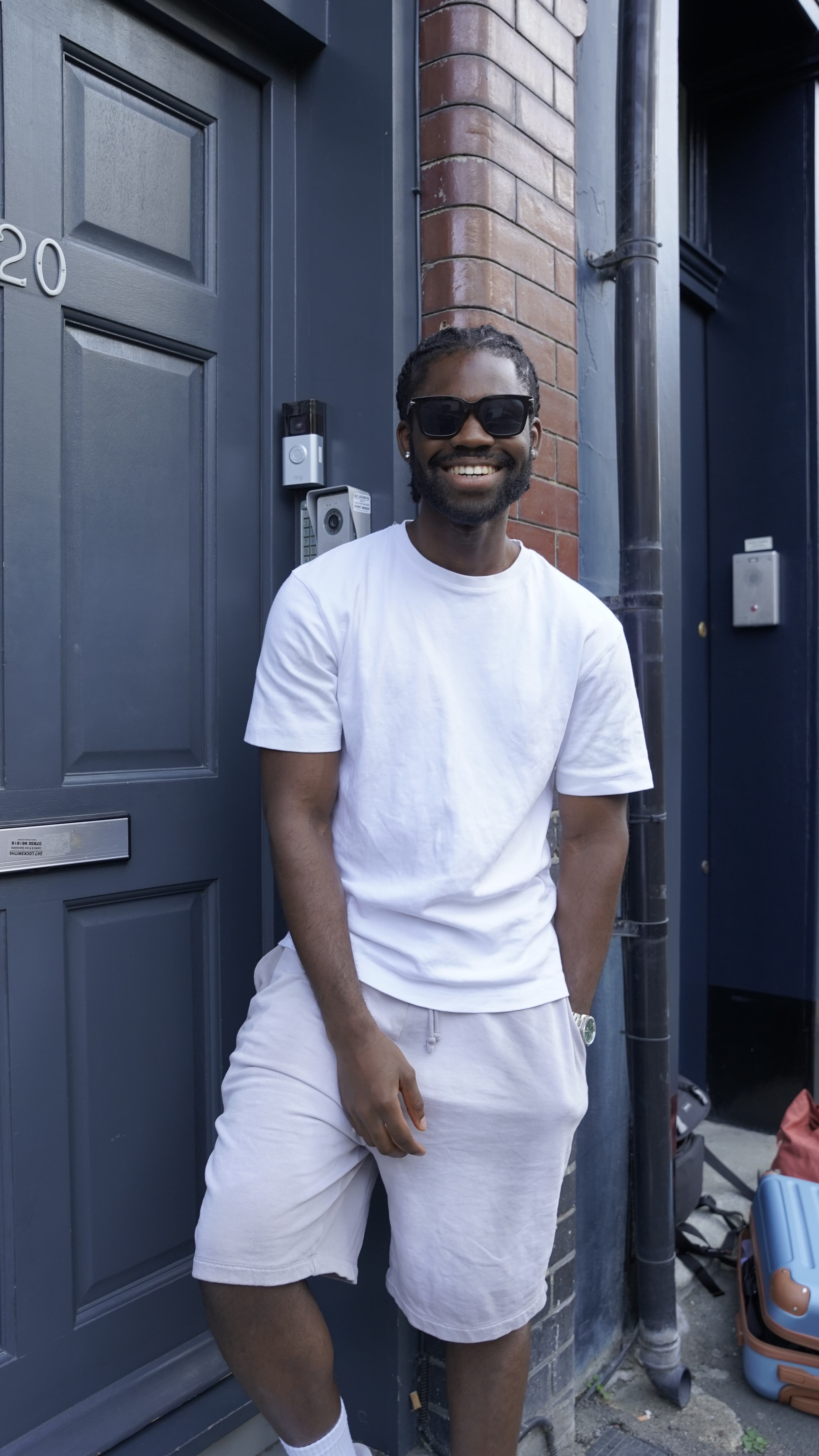 Cameron Dankwa smiling outside in sunglasses